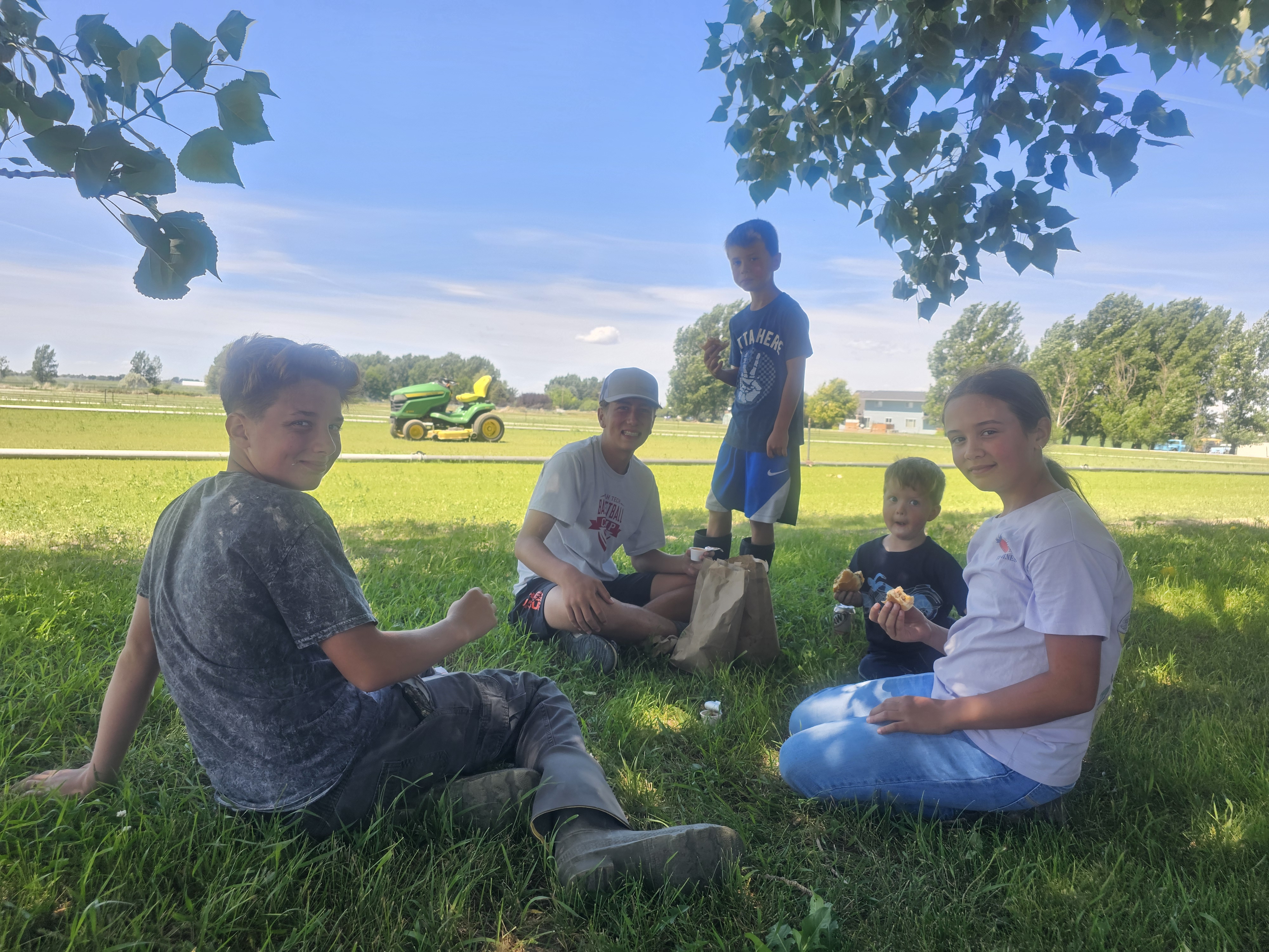 Kids enjoying a picnic on the sod