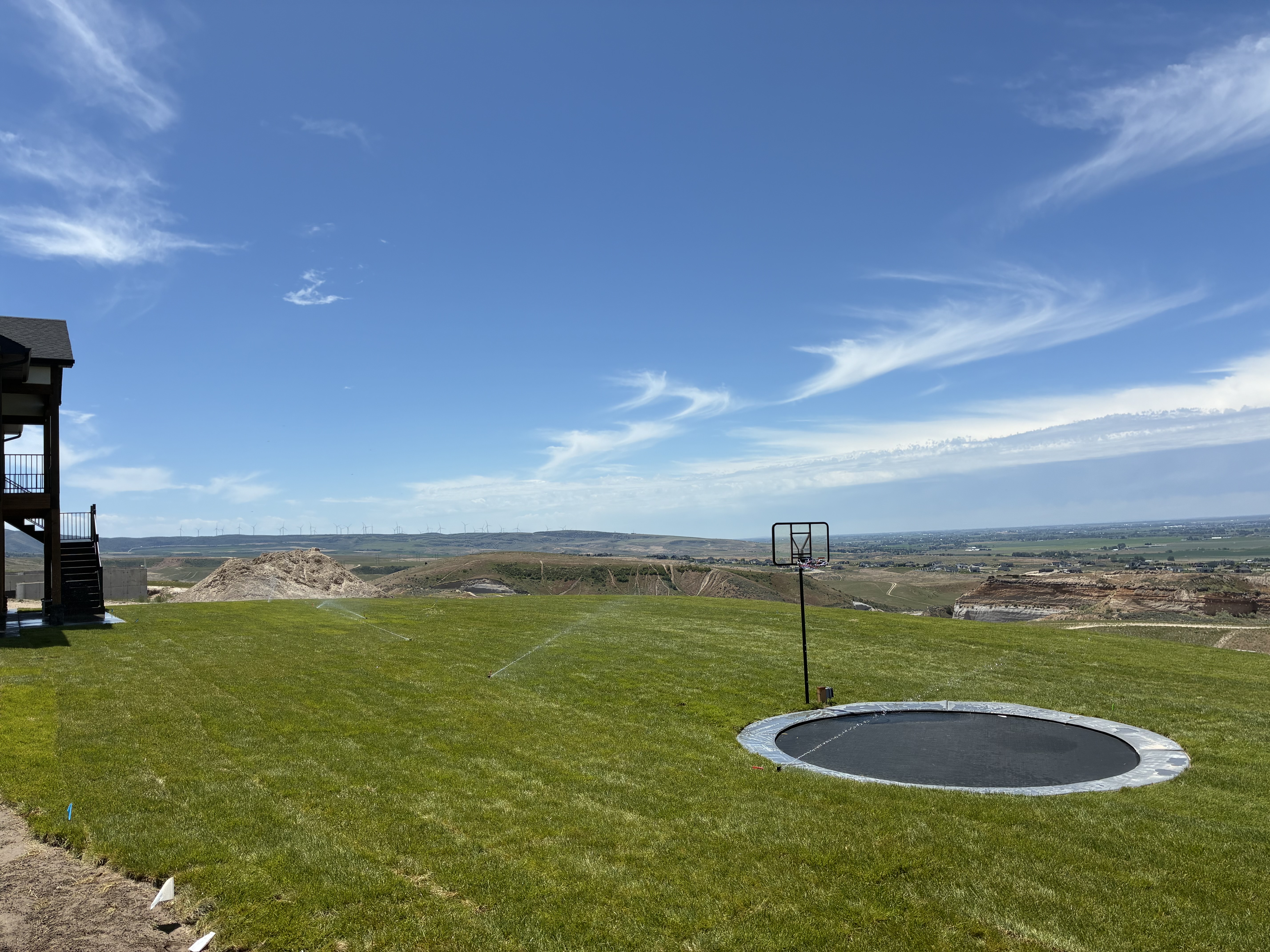 Hilltop backyard install with in-ground trampoline